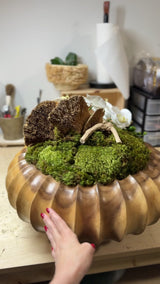 CasaMiami wooden bowl with orchid arrangement